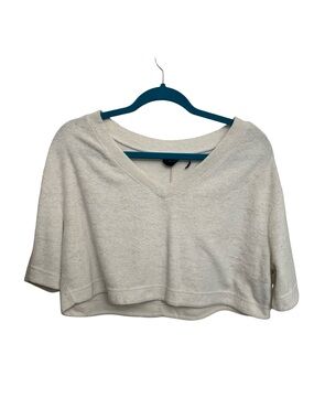 Out from under grey cropped white blouse